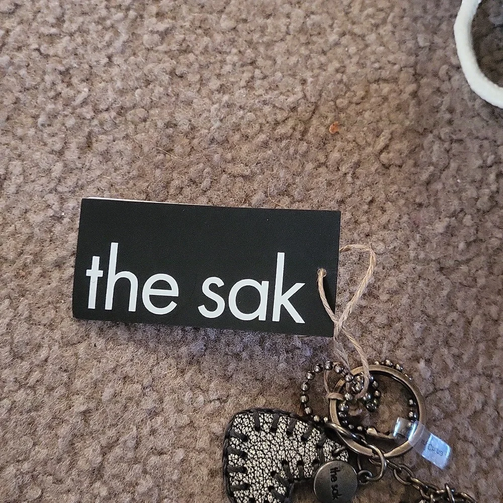 The sak leather triple dark silver hearts Keychain 💕 tagged gorgeous bag